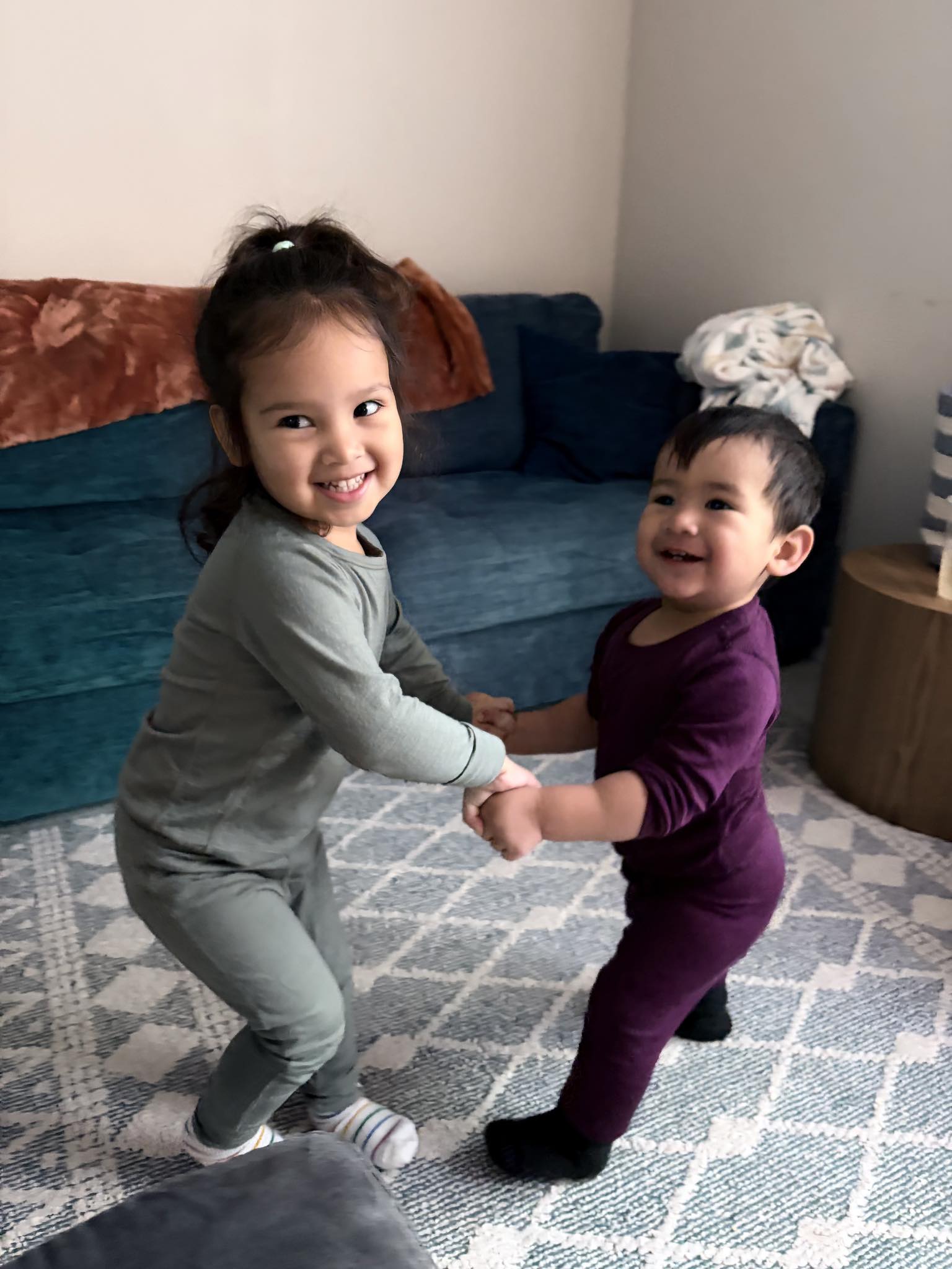 Siblings holding hands - connection and care